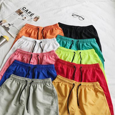 China Wholesale QUICK DRY Running Beach Shorts Polyester Men Shorts Mesh Lining Shorts With Letter Printing For Solid Promotion OEM Adults for sale