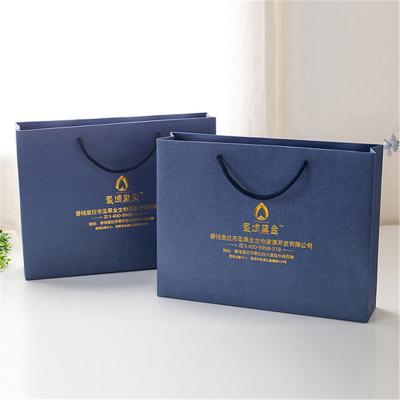 China High Quality Folding Thickening Men's Women's Clothing Gift Shopping Paper Bag Recyclable for sale