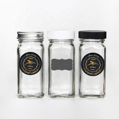 China Stocked OEM Package Square 4oz Spice Glass Jars Containers With Shaker Lids And Empty Round Waterproof Labels for sale