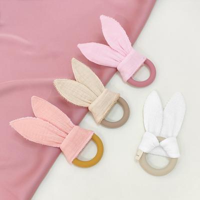 China Soft Ring Teething Toys Baby Teether Ring With Fabric Training Sensory Silicone Toy Newborn Cotton Bunny Ear Aid for sale