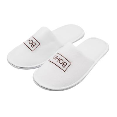 China Comfortable UG Factory Low MOQ Custom Closed Toe Hotel Bedroom Slippers White Velvet Embroidered Disposable Slippers for sale