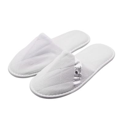 China Indoor Home Outdoor Beach UG custom label cheap disposable personalized hotel slippers comfortable non woven disposable slippers for hotel for sale