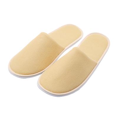 China Indoor Home Outdoor Beach UG Yellow Cheap Wholesale Guestroom SPA Toiletries Supplies Customized Logo Closed Toe Portable Disposable Home Hotel Slippers for sale