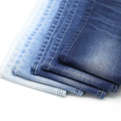 China Twill Denim Fabric Stock Breathable Cheap Stretch Jeans Soft Selvedge Indigo Rolls for sale