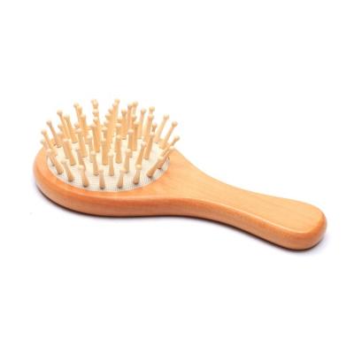 China Professional Soft Cushion Large Area Baby Around Lotus Wood Head Bamboo Pins Paddle Detangling Wooden Hair Brush for sale