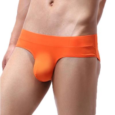 China Antibacterial Pure Color Men Seamless Underwear Briefs Sexy Bump Ball Enhancing Pouch Rise Bikini Bottom Briefs For Male for sale