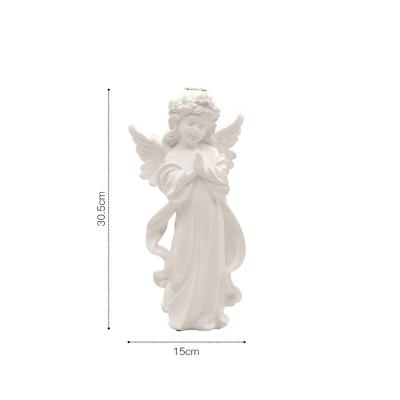 China Pretty Design Eco-friendly White Resin Praying Angel Candle Holder Tealight Holder for sale