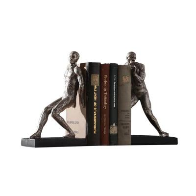 China Custom Made Eco-Friendly Human Figurine Resin Golden Bookends Desktop Bookend Desk Organizer Home Decor for sale