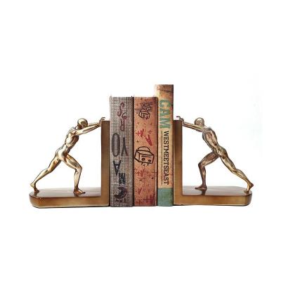 China Eco-Friendly Modern Golden Figurine Resin Book Shelves Organizers Human Bookends Bookends For Kids for sale