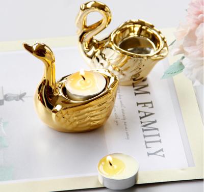 China Middle East Arabic Home Creative Romantic Desktop Decoration Swan Gold Ceramic Candle Holder for sale