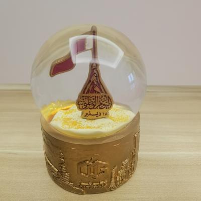 China China Customized National Day Ramadan Handicraft Ornaments Resin Base Qatar Gas Snowball Crystal for sale