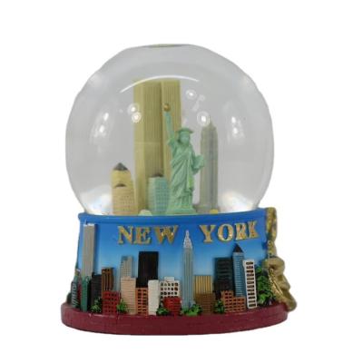 China Handmade Carved Resin Custom Snow Globe for Home Decoration Christmas Gift Resin Crafts and Twin Tower Gift for sale