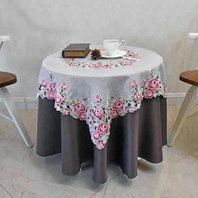 China New polyester disposable idyllic hollow and embroidery table linen sequin tablecloth Lufu table cover for sale