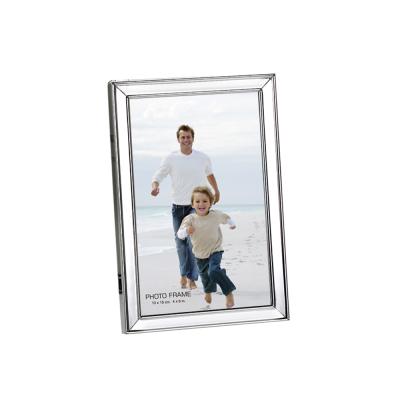 China Decorative Iron Roll Shaped Type Photo Frame Silver Plated Photo Frame for sale