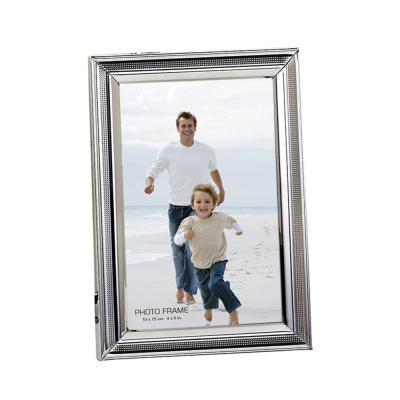 China Decorative Photo Frame Roll Shaped Type Silver Plated Metal Photo Frame for sale