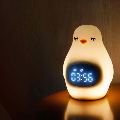 China YIZHI Cartoon Wholesale Led Sleep Trainer Wake Up Clock Soft Silicone Baby Penguin Alarm Clock With Night Light For Kids Room for sale