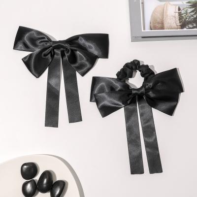 China Soft fashion black hair bow scrunchies with silk ribbon for girls boutique quality hair accessories for sale