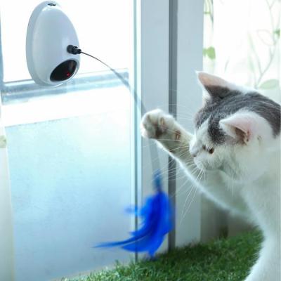 China Viable Pet Supplies Rotating Laser Cat Table Accessories Feather Electric Cat Toy Infrared Cat Toy for sale