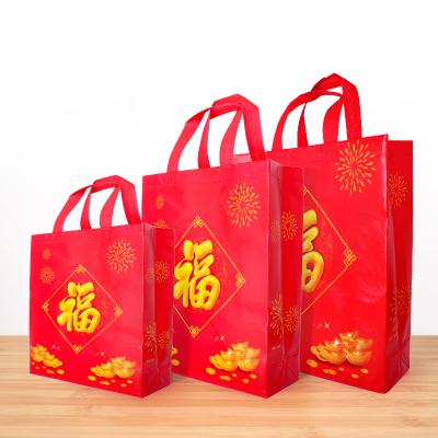 China Disposable Handheld Non-woven Lucky Red Wine Ball Fish Bag Gift Bag High Grade Seafood Cloth Party Favor Bag Party Bag for sale