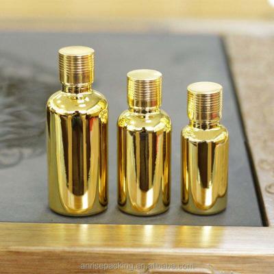 China Personal Care Precision Yellow Gold Plated Different Color Essential Oil Glass Bottle Capacity Gold Glass Bottle Ranging With Aluminum Screw Top for sale