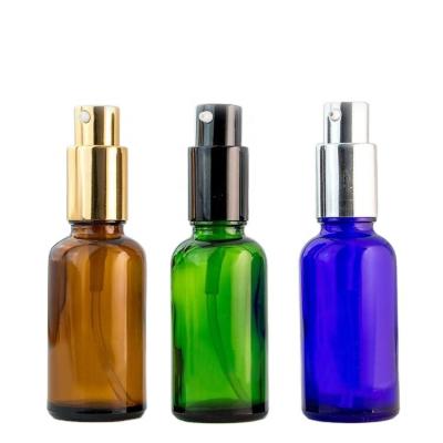 China 10ml 20ml 30ml 50ml 100ml Green Amber Blue Glass Essential Oil Perfume Spray Bottles Gold Aluminum Pump Spray Bottle for sale