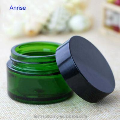 China Wholesale 5g 10g 20g 30g 50g Empty Refillable Green Glass Jar Face Skin Care Cosmetic Glass Jar Cream Care Cream Jar with Black or Aluminum Lid for sale