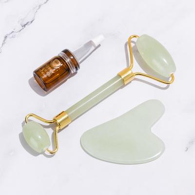 China Healthy Cosmetic Facial Tool Anti-Puffiness Christmas Gift Beauty Jade Opal Roller For Face Anti Aging for sale