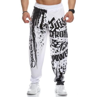 China Men's Breathable Jogger Pantalones Mesh Fabric Breathable Graffiti Pattern Sweat Track Jogger Pant for sale