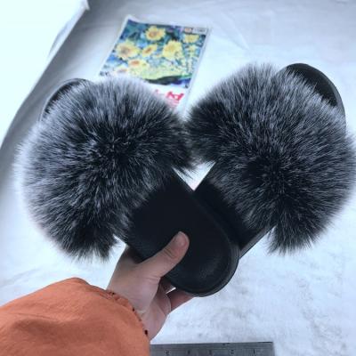 China CUSHIONING Flip Flop Imitation Raccoon Dog Hair Beach Shoes Fox Sandals Furry Women Imitation Hair Women's Slippers for sale