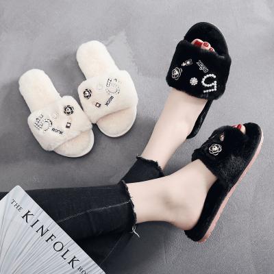 China CUSHIONING new plush shoes manufacturers sell Korean flip flops and wholesale non-slip flat bottom plush slippers outside the home for sale