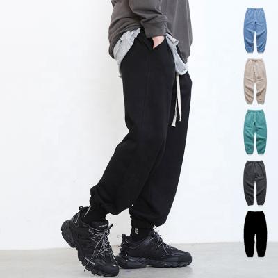 China Anti-pilling Unisex Loose Cotton Sports Track Jogger Man Pants Adjustable Ropes With Elastic Leg Jogger Open Sport Tracksuit for sale