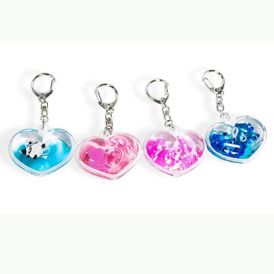 China XINBAOHONG Traditional Wholesale Liquid Fashionable Glitter Powder Moving Floating Key Chain for sale