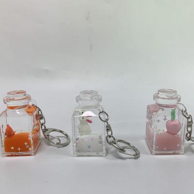 China Lovely Animal Waterproof Customized Key Chains In The Drift Sand Bottle Pendant Liquid Oil Keychain for sale