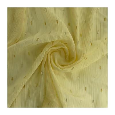 China 2022 hot sale 100%polyester fabric gold and silver chiffon fabric anti-static crepe yarn metallic cut flower fabric for fashion dress for sale