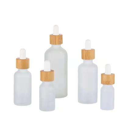 China Daily Life Factory Price Bamboo Lid Frosted Glass Cosmetics Oil Bottle Dropper Bottle With Dropper for sale