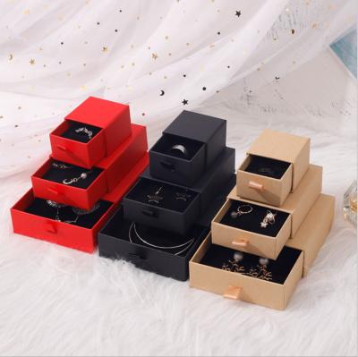 China Fashionable Ready to Ship Logo Print Black Kraft Paper Logo Print Jewelry Packaging Ring Boxes Drawer Type Jewelry Box for sale