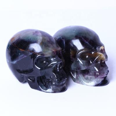 China Wholesale High Quality Natural Europe Fluorite Skulls Crystal Healing Crafts Quartzl Gemstone Carving Folk Crafts Feng Shui For Home De for sale