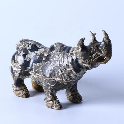 China Europe High Quality Hand Carved Healing Stones Crystal Crafts Xiuyan Jade Rhinoceros Jade Carvings For Feng Shui Decoration for sale