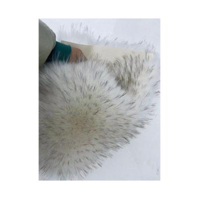 China Soft and Luxurious Knitted Backing White Fur with Black Tip Dyed Color Pom Fur Fabric for sale