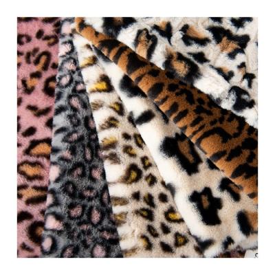 China Weft Knitted 100% Polyester Super Soft Leopard Print Rabbit Fur Faux Fur Fabric Thick for sale