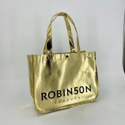 China Recyclable gold metallic laminated non woven tote bag with black plastic button and can be customized your logo on it for sale