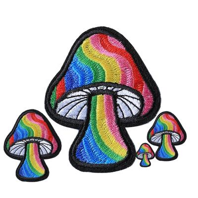 China Viable Custom Iron On Colorful Logo Embroidery Mushroom Woven Patterns Apparel Woven Patches Fabric Patch for sale