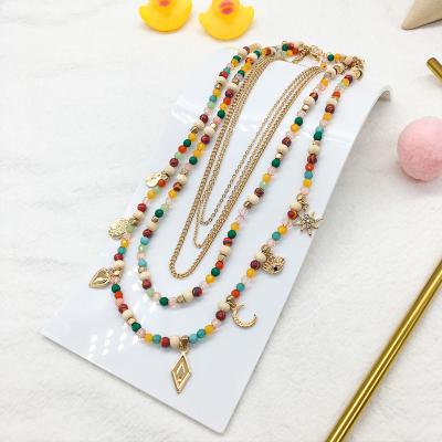 China Cute Colorful Pearl Chains And Multi Layer Chain Necklace With Gold Plated Charms For Women for sale