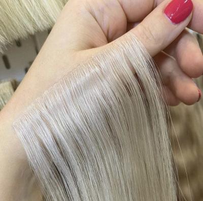 China Silky straight fixed factories producing large quantities of high quality invisible tape hair for sale