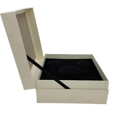 China Luxury Special Paper Tape Embossing Clamshell Box Present Box with Pearl Cotton Internal Parts for sale