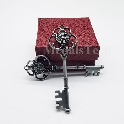 China Promotional Gifts Decoration 3D Props Cut Christmas Gift Antique Key Metal Key Chain With Festive Ribbon for sale