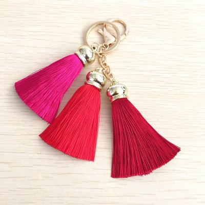 China Custom Made Long Lasting Artificial Colorful Fringe Bohemian Tassel Logo Key Chain With Metal Hanger For Bags And Key Chain Decoration for sale