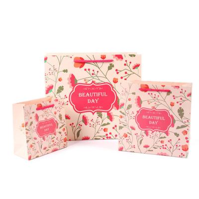 China New Product Small Flower Vertical Paper Bags Eco-friendly Pattern Portable New Product Store Cake Gift Bag for sale