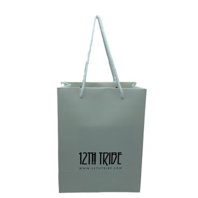 China Recyclable Custom Design Logo Service Foldable Paper Shopping Packaging Portable White Gift Bag for sale