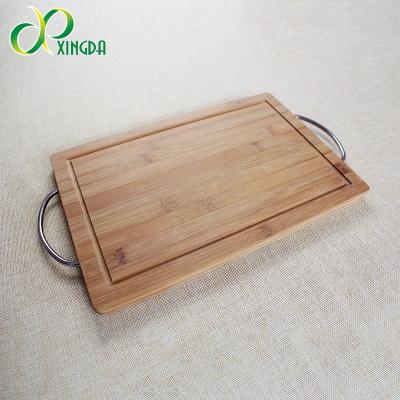 China Sustainable High Quality Premium Bamboo Cutting Board with Juice Groove and Metal Handles for sale